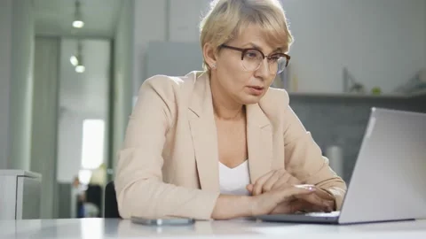 Woman it-specialist creating program on laptop, working with code, has problems Stock Footage 220785648