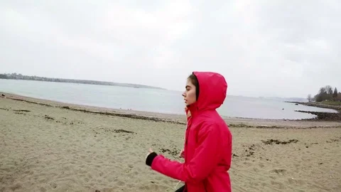 Woman jogging on beach Stock Footage