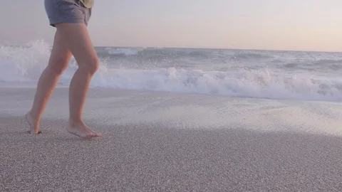 Woman Jogging at the Beach Stock Footage