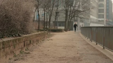 Woman Jogging By The Spree River in Berlin Stock Footage