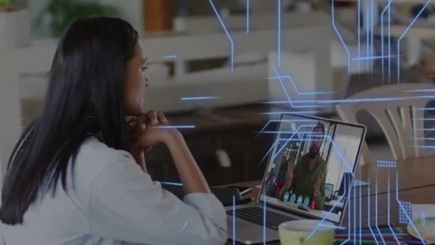 Woman joining remote call at table, reviewing code for tech while data lines Stock Footage 334768851