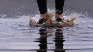 Woman Jump In Dirty Water After Rain, Feet Close Up Stock Footage