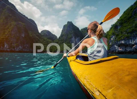 Woman with the kayak Stock Photos