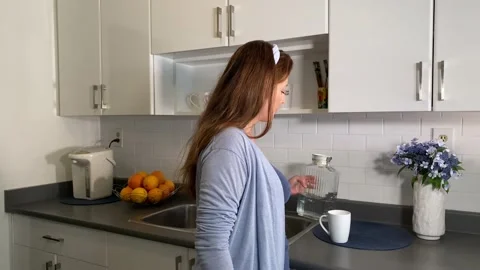 Woman in a Kitchen Stock Footage 137215092