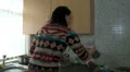 Woman in kitchen having heated discussion HD Footage