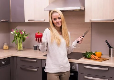 Woman in kitchen Stock Photos