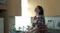 Woman at the kitchen sink cleaning HD Footage