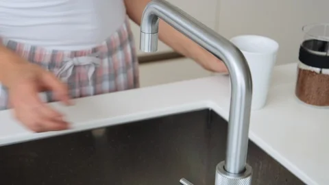 Woman In Kitchen Using Tap Stock Footage 117065871