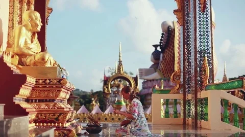 Woman on the knees burn incense stick in temple. Koh Samui, 1920x1080 Stock Footage