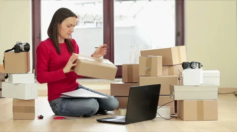 Woman labeling parcel for dispatch HD 스톡 동영상 60665138