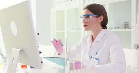 Woman laboratory worker writes down detailed data in document Stock Footage 318328283