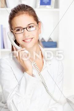 Woman on land line call Stock Photos