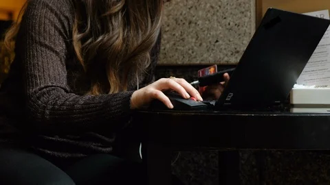 Woman on a laptop computer Stock Footage 107933052