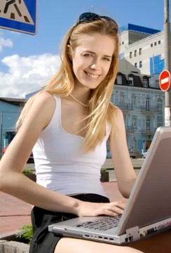 Woman with laptop in a hi-tech urban surrounding Stock Photos