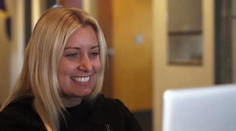 Woman Laughing while using Laptop Video stock 42522762