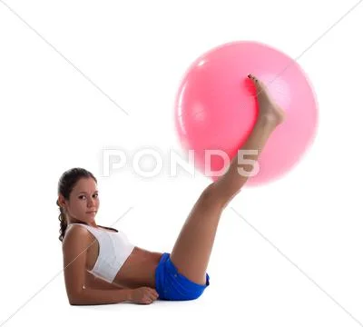 Woman lay and take fitness ball with legs Stock Photos
