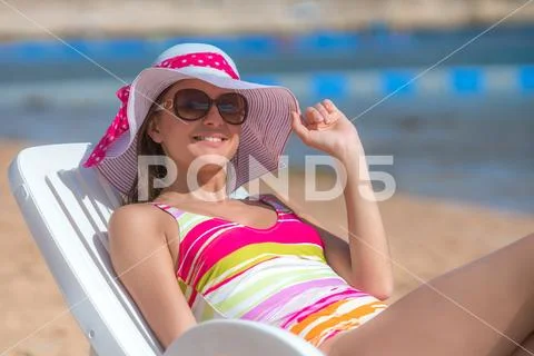 The woman lay on the background the sea Stock Photos
