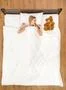 The woman lay on the bed with the soft toy. View from above Photo