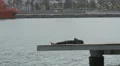 Woman laying and relaxing on the seafront in the port of Barcelona 4k or 4k+ Resolution