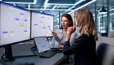 Woman Leads Project Tasks Using Tablet To Improve Workflow Efficiency. Stock Photos