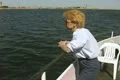 Woman leaning against boat railing Footage