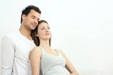 Woman leaning against man's chest Stock Photos
