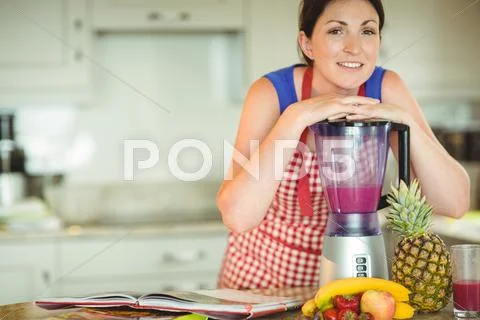Woman Leaning Face On Mixer