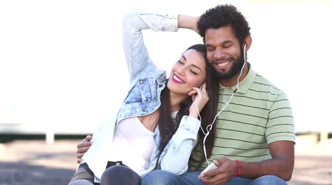 Woman leaning head on man's shoulder while they listening to music Stock Footage 59555665