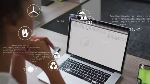 Woman leaning at laptop watching code loading and animating eco metrics icons Stock Footage 332577625