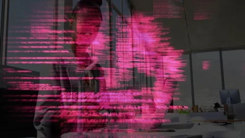 Woman leaning over desk using hands, manipulating pink code overlay, visualizing Stock Footage 328418148