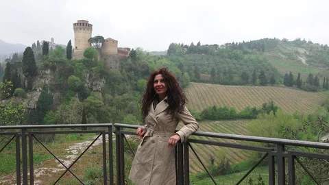 Woman leaning on parapet Stock Footage