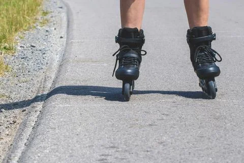 Woman learn inline skating Stock Photos