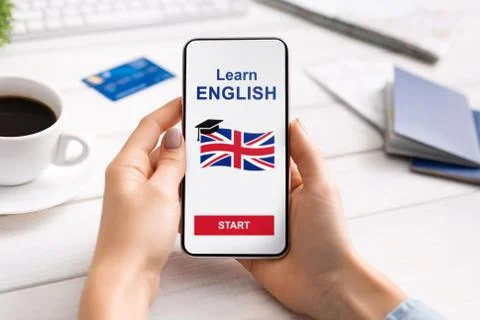 Woman Learning Foreign Language With Application On Smartphone Before Travel Stock Photos