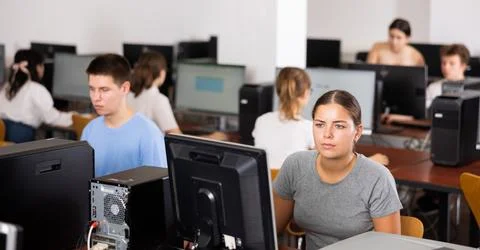 Woman learning to use software in computer class 스톡 사진