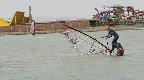 Woman learning to windsurf Stock Footage 50203520
