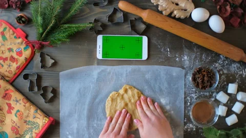 A woman learns how to make gingerbread cookies or woman teaches how to cook Stock Footage 144473071