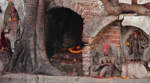 A woman leaves an offering to the deity at the altar Stock Footage 59138647