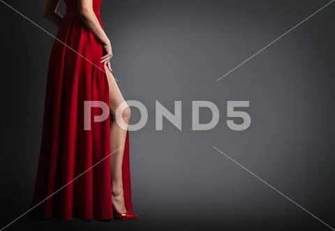 Woman Leg and Red Dress Isolated on Black Background, Sexy Fashion Model Legs Stock Photos
