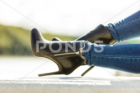 Woman Legs In Denim Pants Heels Shoes Outdoor