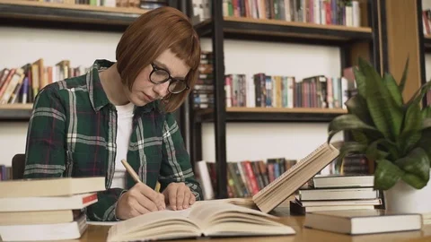 Woman  in the library Stock Footage 106210253