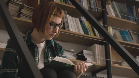 Woman  in the library Stock Footage 106210567