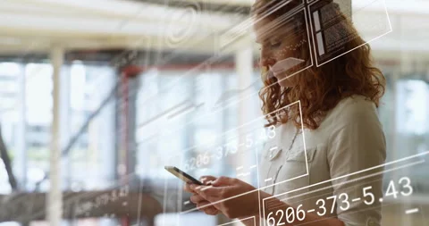 Woman lifting smartphone, checking data in tech hub, starting digital overlays Stock Footage 312695268