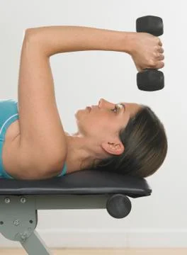 Woman lifting weights Stock Photos