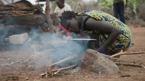 Woman lighting campfire 動画素材 59796330