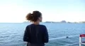 Woman Listening Music and Enjoying Sea View from the Ship. Sea Voyage Among the HD Footage