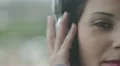 woman listening to music on big headphones HD Footage