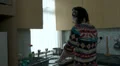 Woman listening to music doing housework HD Footage