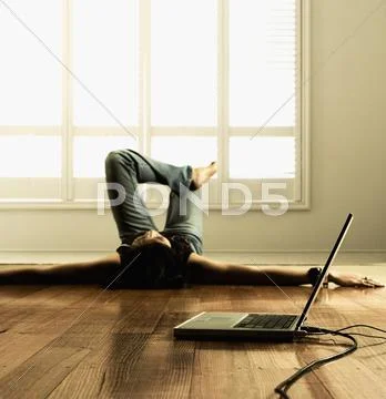 Woman listening to music with laptop Stock Photos
