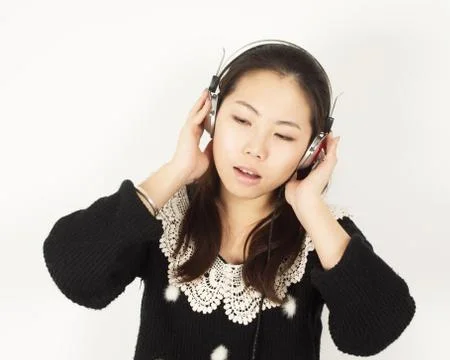 Woman listening to music Stock Photos