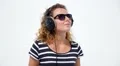 Woman Listening to Music in Professional Headphones. Slow Motion. HD Footage